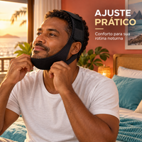 Homem adulto brasileiro ajustando faixa para queixo em ambiente de quarto