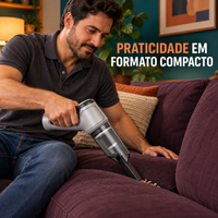 Aspirador portátil cinza usado para limpar um sofá em sala decorada